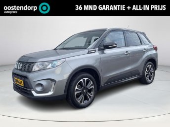Suzuki Vitara 1.0 Boosterjet Stijl Elektronisch schuif- kanteldak | All seasonbanden | Parkeersensoren voor- en achter | Navigatiesysteem | Afneembare trekhaak | Adaptieve Cruise Control | Climate Control | 36 maanden GARANTIE occasion 2019